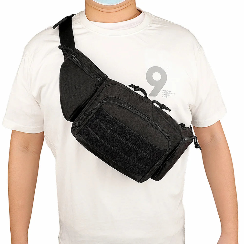 Man wearing a black military-style tactical bag across his chest as a sling bag